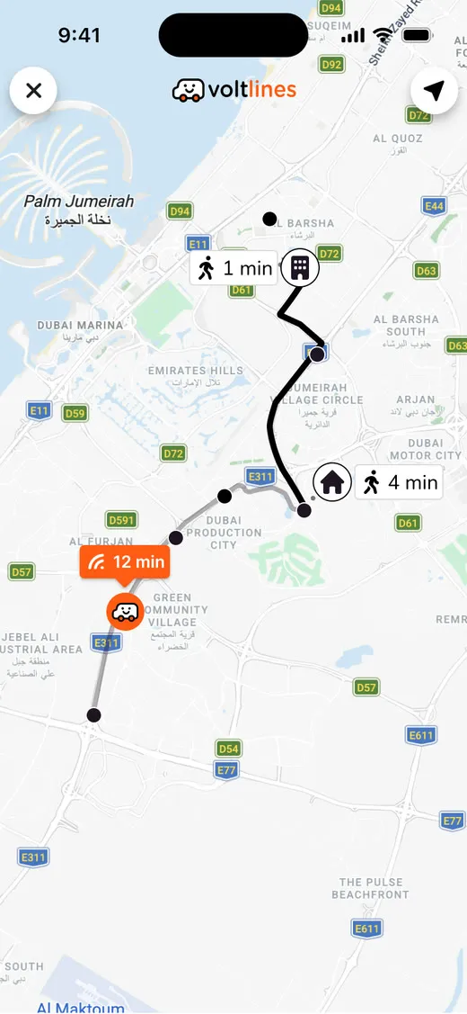 The passenger app tracking the vehicle across Dubai: twelve minutes away, a minute of walking to the stop, and the trip marked as en route