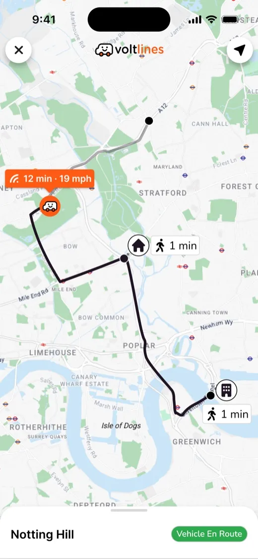 The passenger app tracking the vehicle across east London: twelve minutes away, one minute of walking to the stop, and the trip marked as en route