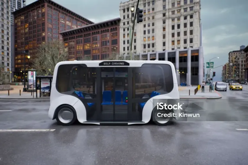 A self-driving electric shuttle at a city junction